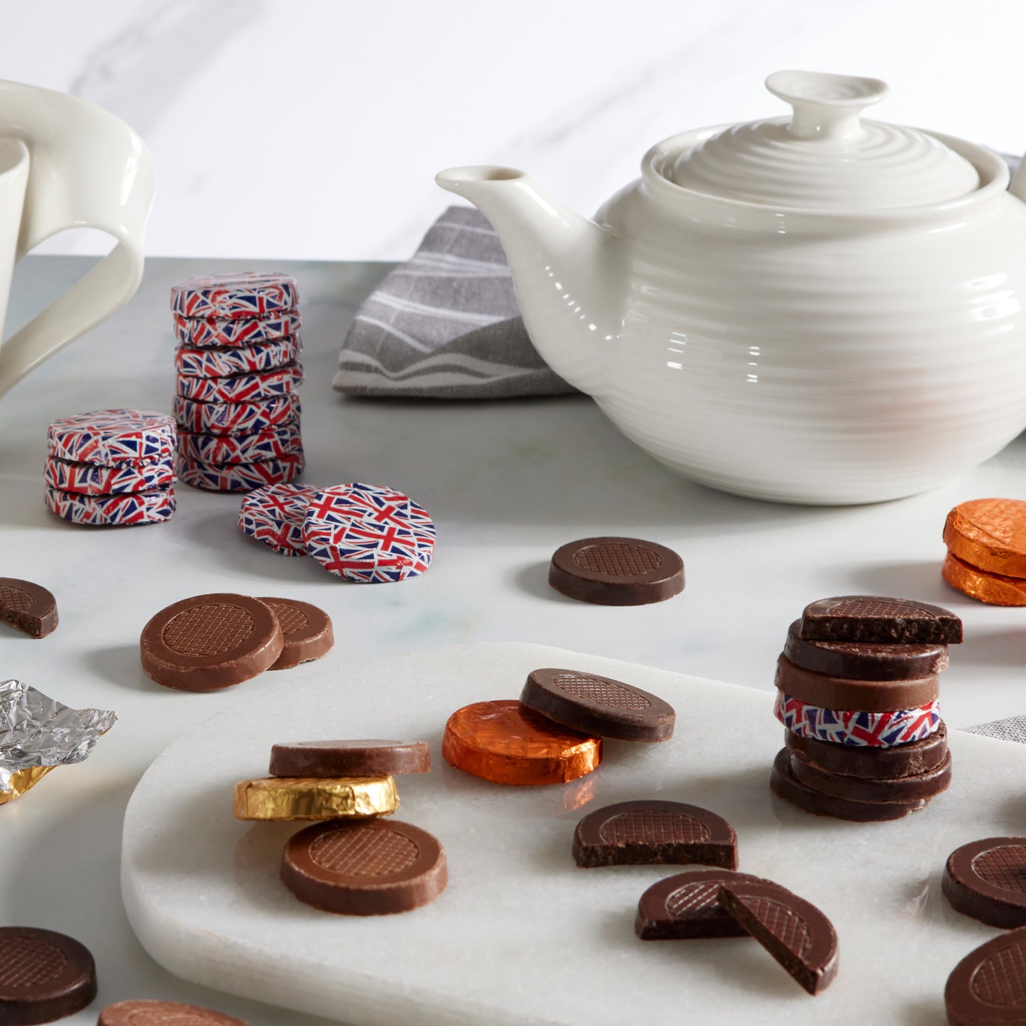 Rich Signature Dark Chocolate Crisps, masterfully blended with invigorating peppermint oil and the delightful crunch of sugar crystal pieces. Each of the approximately 155 individually wrapped chocolates is encased in distinctive Union Jack foil, reflecting a proud heritage and a commitment to quality