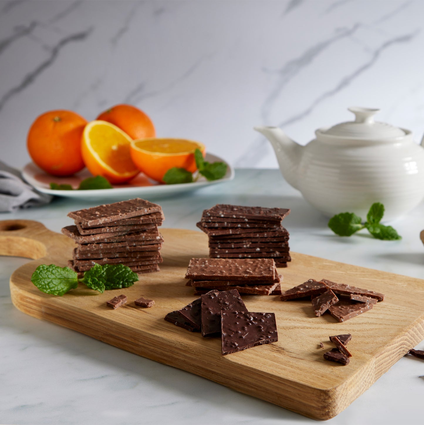 Dark Chocolate Wafer Thins, infused with the warm, spicy essence of natural ginger oil and the delightful texture of sugar crisp inclusions