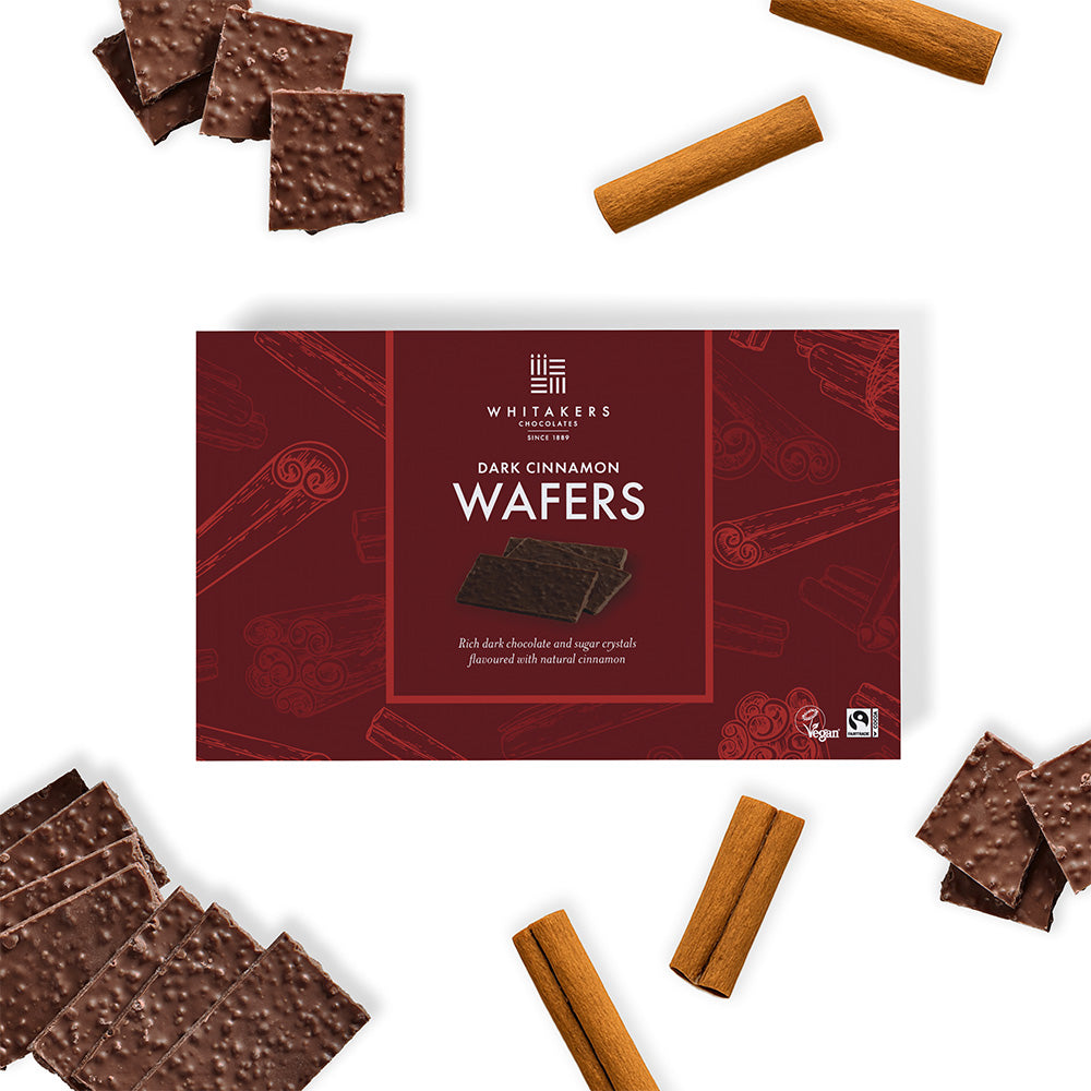 Whitaker's Dark Cinnamon Wafers packaging with wafers and cinnamon sticks on a white background