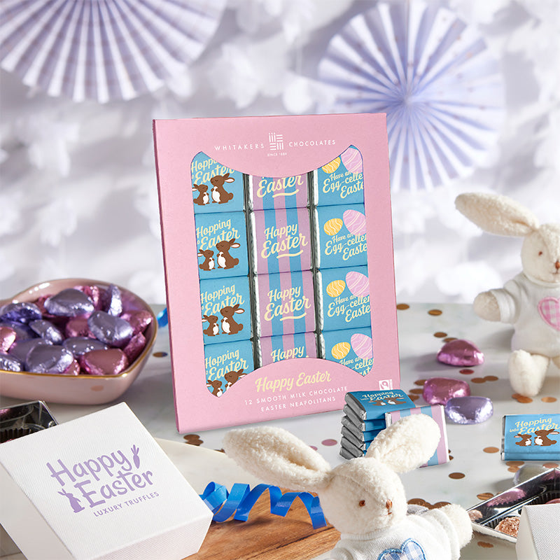 Box of Easter-themed chocolate square neapolitans with a pink lid and 'Happy Easter' text.