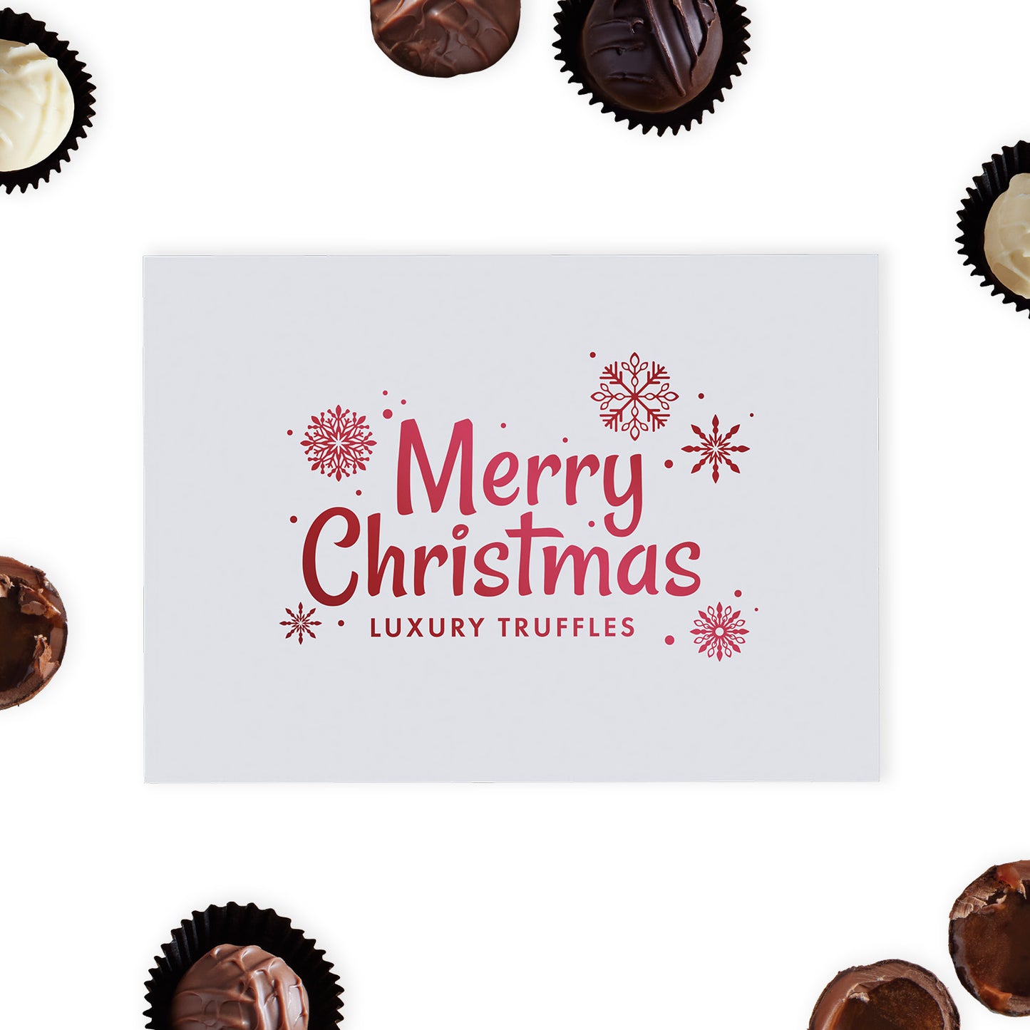 This exquisite white gloss box is beautifully adorned with "Merry Christmas" and delicate snowflakes in radiant red foil blocking, creating a stunning visual appeal that captures the spirit of the holidays. Inside the box, discover a selection of twelve milk, white and dark hand-finished truffles