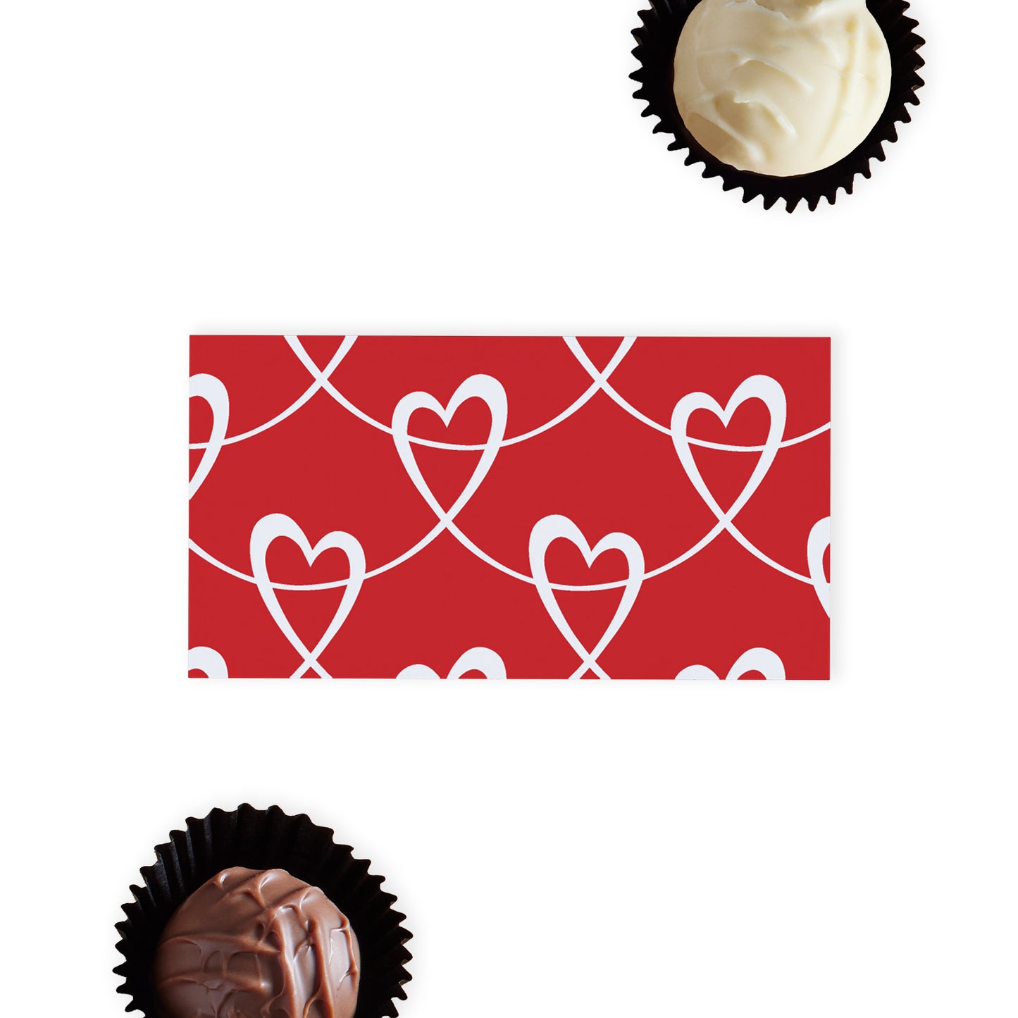 Love Hearts Chocolate Gift Ballotin, a charming and delightful offering perfect for that special someone. This adorable white and red gift box is designed to capture the heart, making it an ideal present for Anniversary, Valentine's Day, or just because. Inside, the lucky recipient will find a selection of two delicious hand-finished truffles, one in smooth milk chocolate and the other in luxurious white chocolate