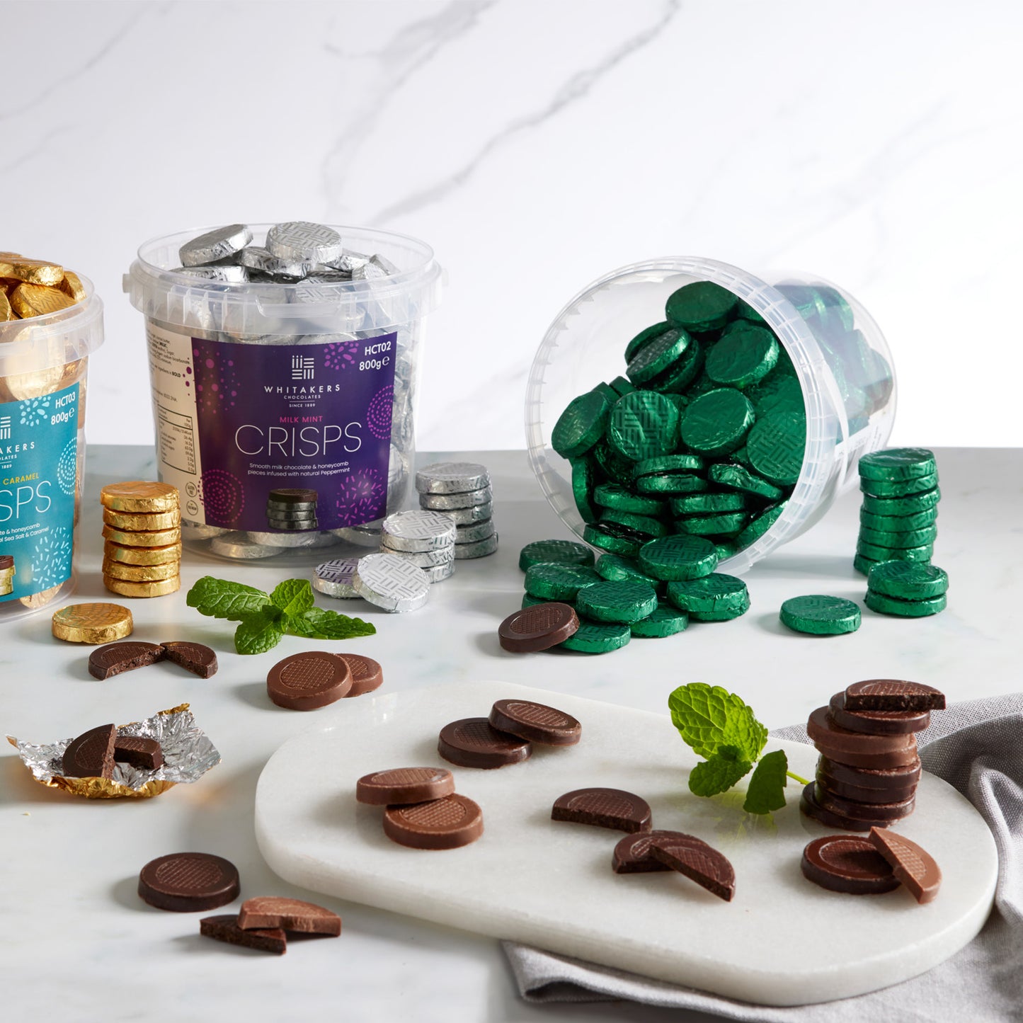 green foiled dark chocolate mint honeycomb crisps packed in 800g clear tubs