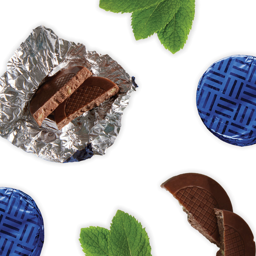 Milk Chocolate Crisps, infused with natural peppermint oil and adorned with the delightful crunch of sugar crystal pieces