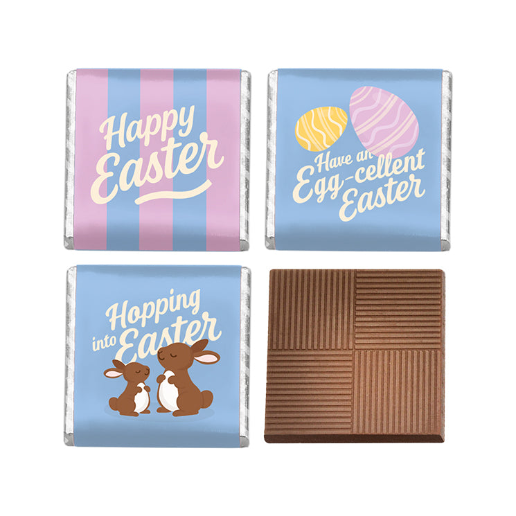 Four Easter-themed chocolate squares with decorative wrappers on a white background