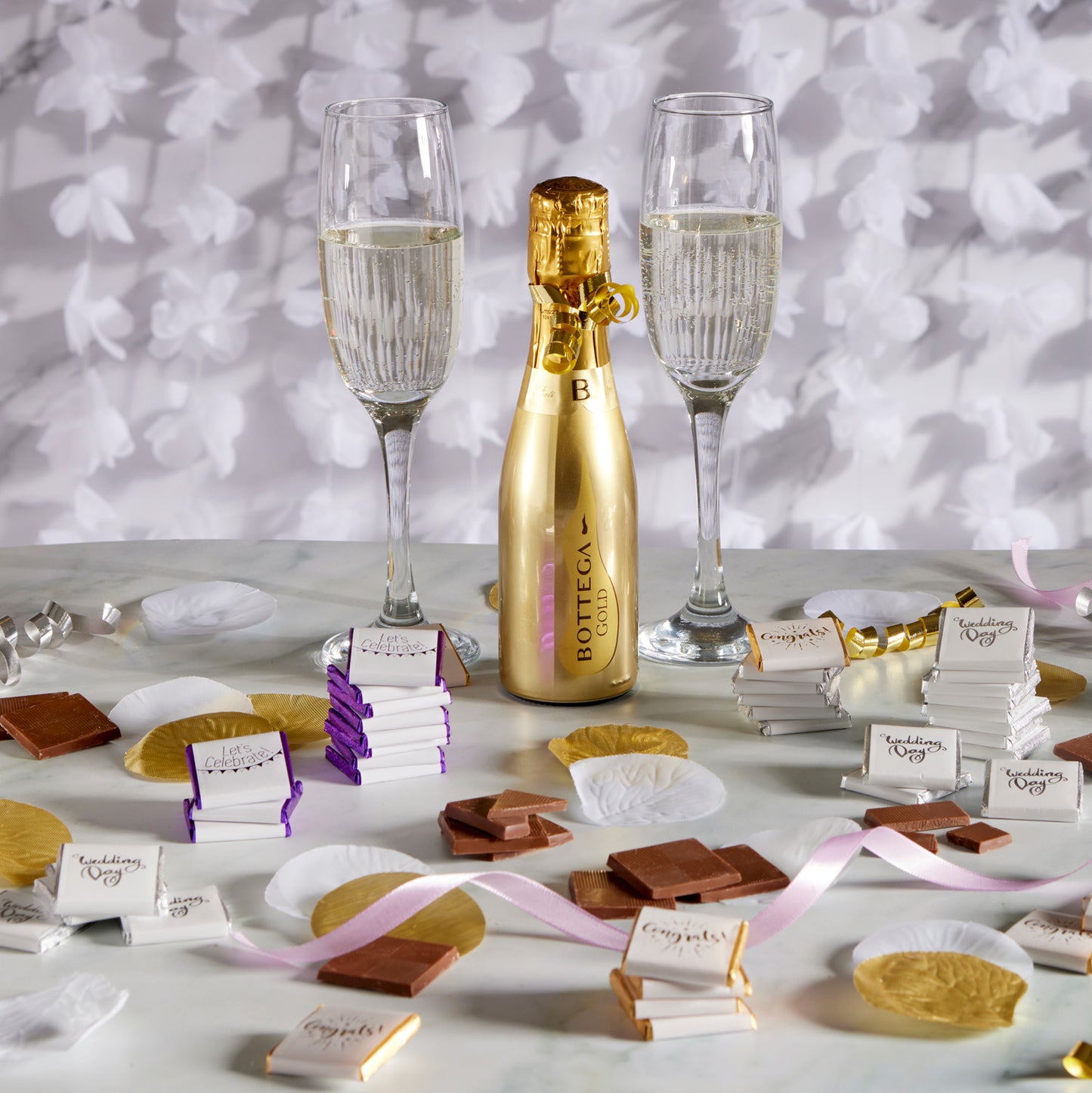 Milk Chocolate Neapolitans, designed to celebrate love and union.  Each chocolate is delicately wrapped in luxurious foil and encased in a pristine white paper wrapper, beautifully adorned with 'wedding day' in graceful silver print.  This bulk 2kg box, containing 400 individually wrapped chocolates