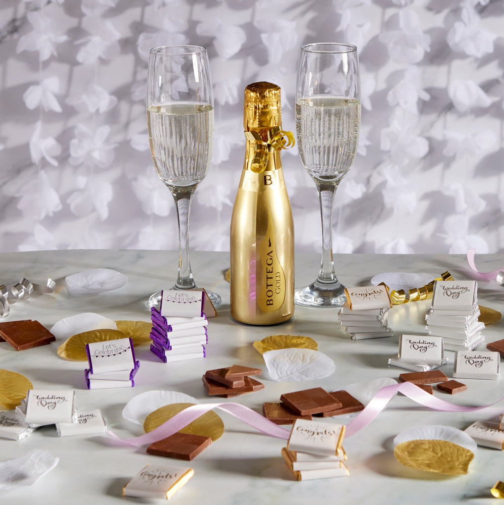 Milk Chocolate Neapolitans, designed to celebrate love and union.  Each chocolate is delicately wrapped in luxurious foil and encased in a pristine white paper wrapper, beautifully adorned with 'wedding day' in graceful silver print.  This bulk 2kg box, containing 400 individually wrapped chocolates