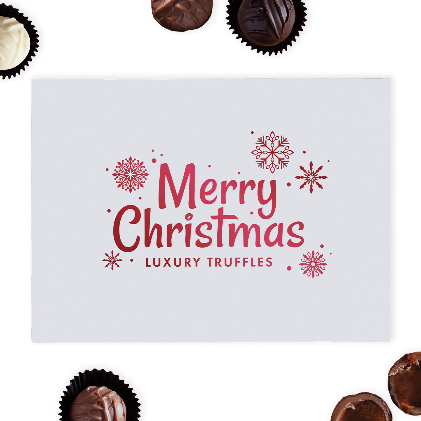 This exquisite white gloss box is beautifully adorned with "Merry Christmas" and delicate snowflakes in radiant red foil blocking, creating a stunning visual appeal that captures the spirit of the holidays.  Inside the box, discover a selection of twenty-four milk, white and dark hand-finished truffles