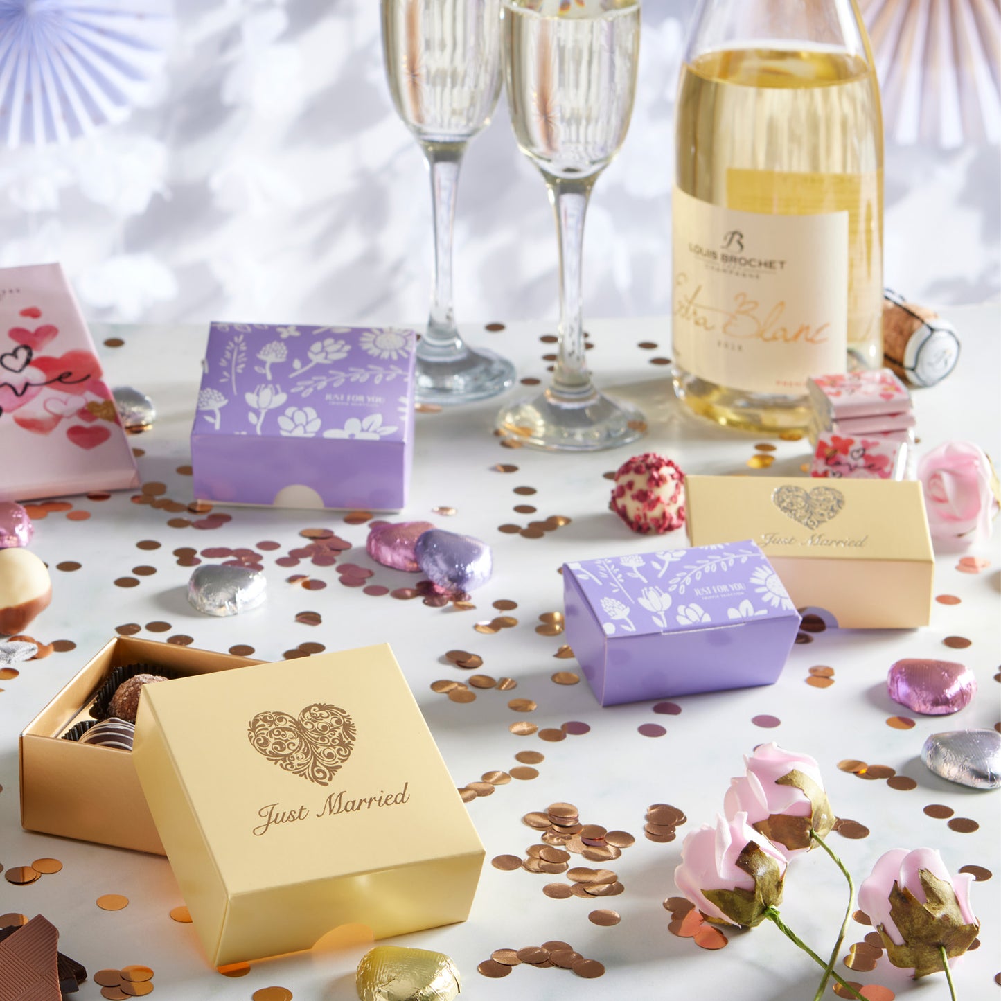 "Congratulations" Chocolate Gift Box, designed to mark every achievement with a touch of Luxury. This elegant white Luxury box features gold foil-printed champagne glasses and the word "Congratulations," making it a sophisticated choice for any congratulatory occasion. Inside, recipients will find two exquisite hand-finished truffles, one in rich milk chocolate and the other in creamy white chocolate