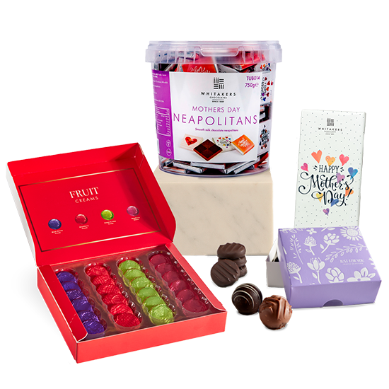 Collection of Mother's Day gifts including a box of chocolates, Neapolitans, and a card on a white background.