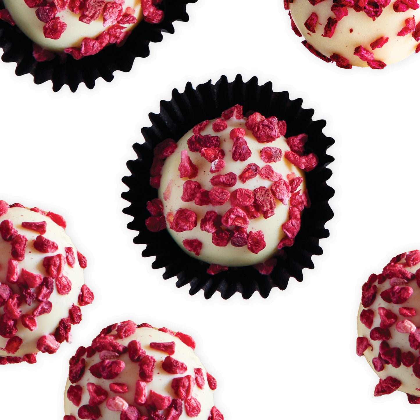 Luxurious White Chocolate Raspberry and Marc de Champagne Truffle Bulk Box, finished with freeze dried raspberry pieces