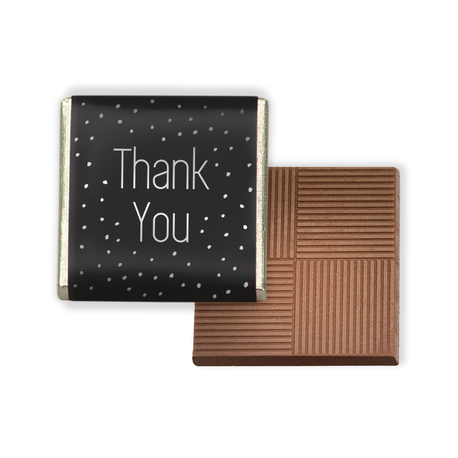Milk Chocolate Neapolitans, a smooth and creamy delight that conveys appreciation in every bite. Each chocolate is meticulously wrapped in a combination of Luxury foil and paper, showcasing an elegant black wrapper accented with 'thank you' in graceful silver print